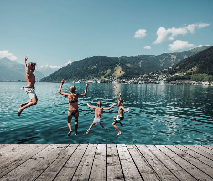Family jumping into the Zelle lake